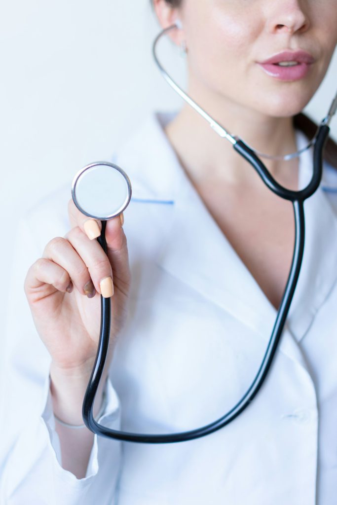 A clinician holding a stethoscope
