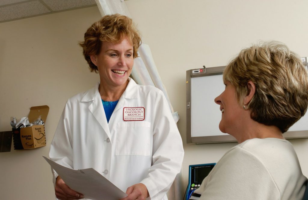A doctor talking with a patient during a consultation