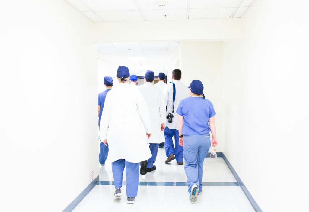 A hospital team walking along a corridor