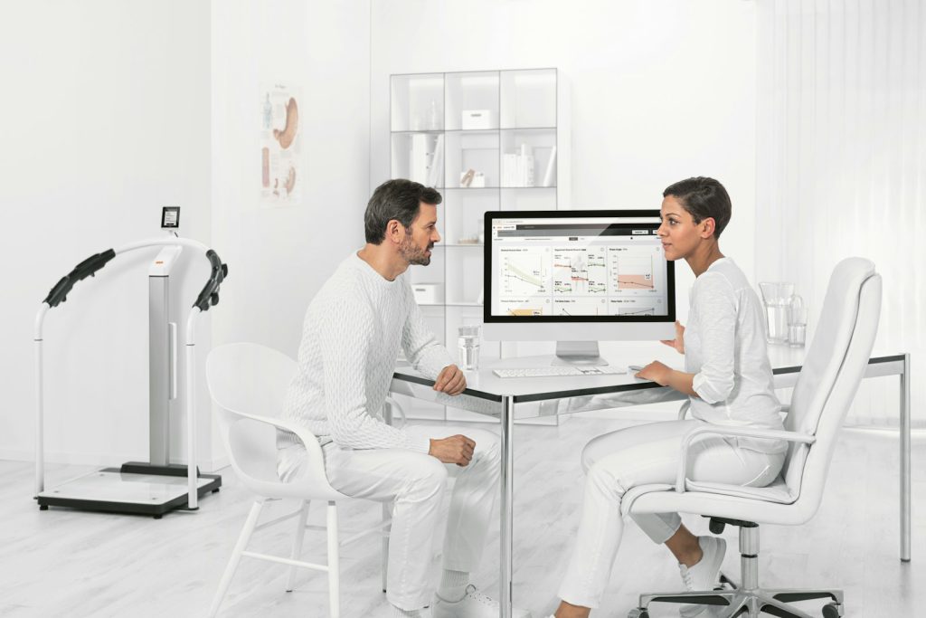 A patient and a clinician reviewing results together
