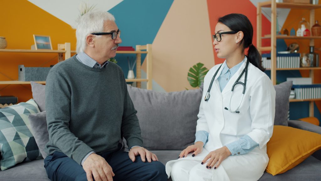 Doctor talking with an elderly patient