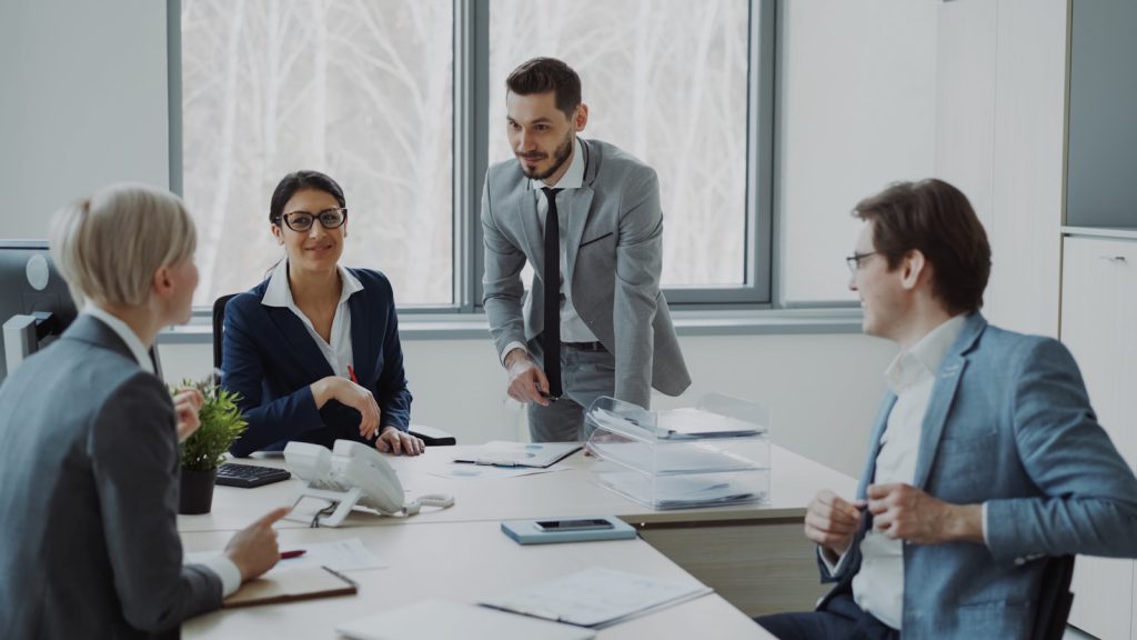 Professionals collaborating around a conference table